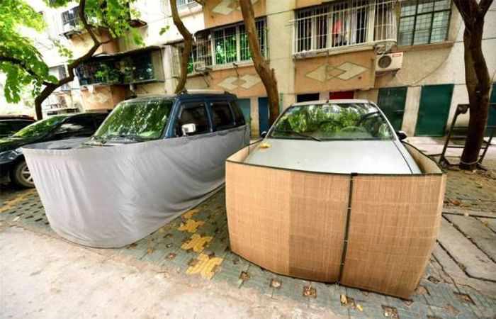 Chinese Drivers Covering Their Cars with Rat-Proof Cover -08